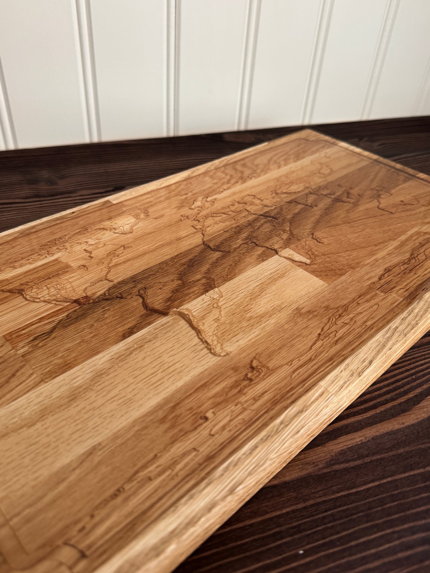 Epoxybricka med graverad världskarta